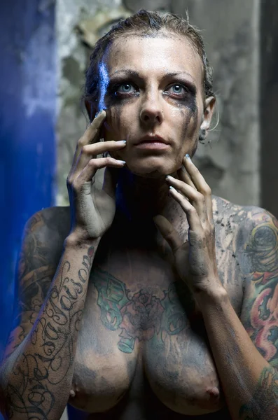 Naked tattooed woman by Aleksandrs Tihonovs Stock Photo Editorial Use Only