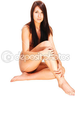 Nude woman sitting.